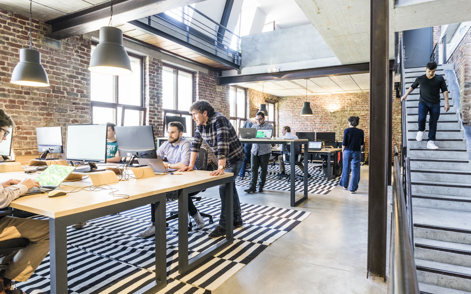 Engineers pairing on a build in a software studio